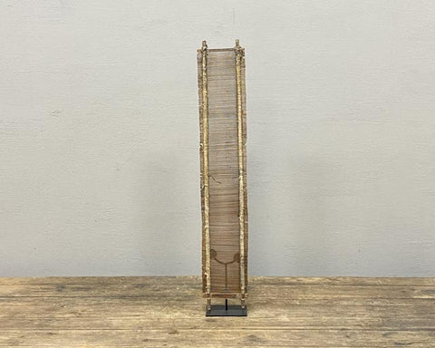 Antique weaving reed on stand